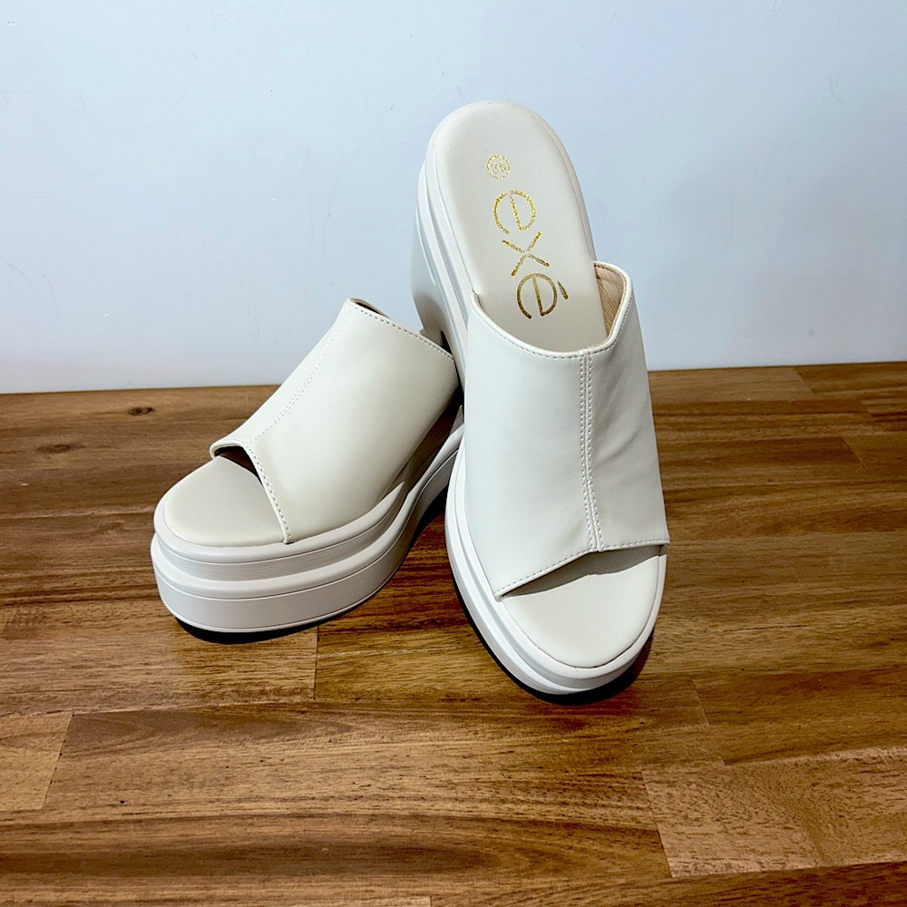 EXE slip on wedge sandal.